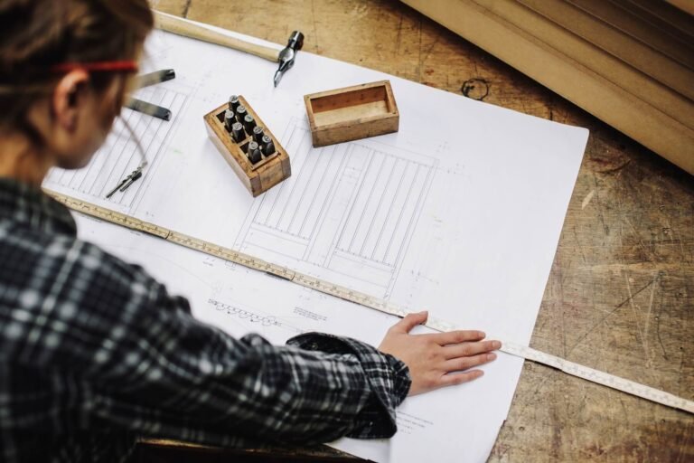 young-craftswoman-measuring-blueprint-in-pipe-orga-2024-11-03-05-31-53-utc